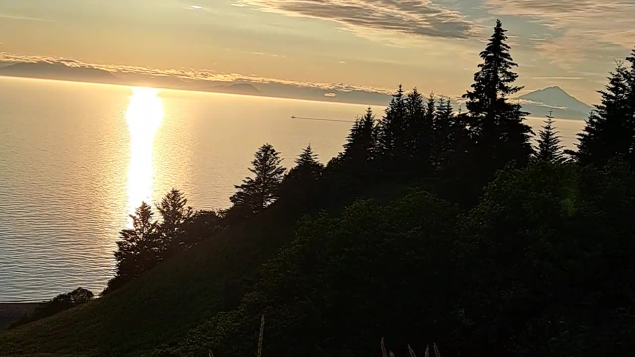 Iliamna Mountain and Redoubt Mountain on 7/29/23 at sunset. Alaska