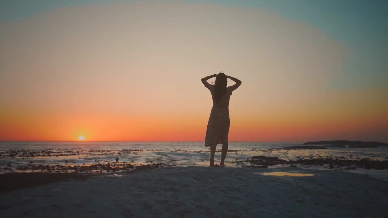 Beautiful Girl Enjoying Beach Sunset