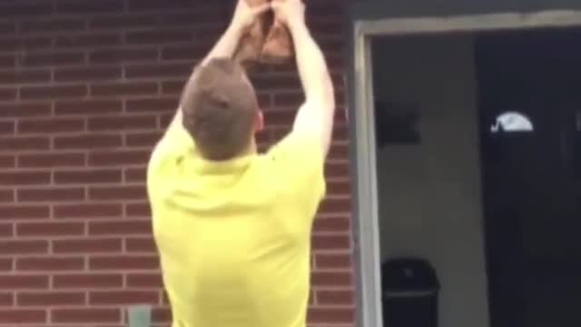 Guy Fails To Catch His Friend While She Comes Down The Roof