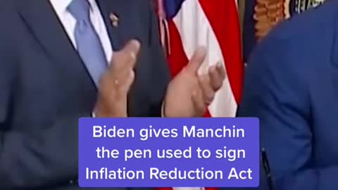 Biden gives Manchin the pen used to sign.Inflation Reduction Act