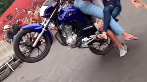 Funny wheelie with girl