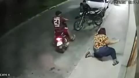 Extremely obese lady tips over a bike and fall off