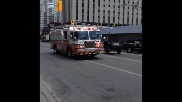 Firetruck Blasting by on Rideau Street Ottawa Ontario.