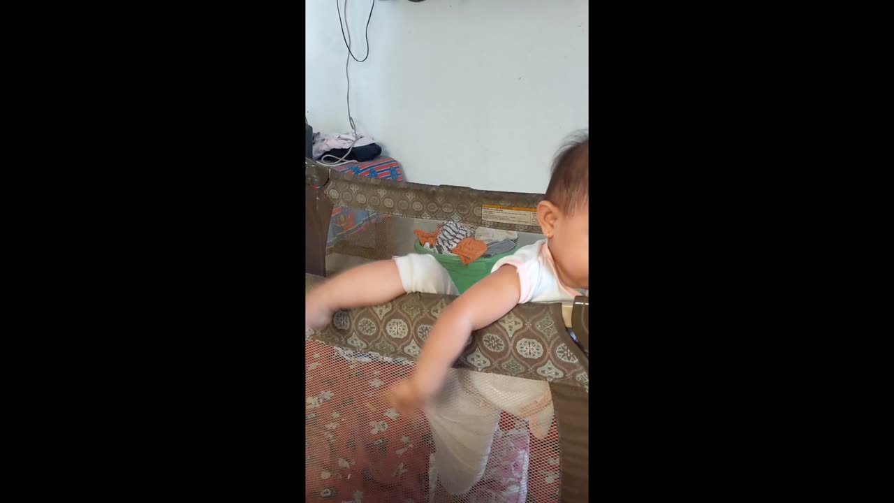 The Great Escape: Watch This Baby Girl's Hilarious Attempts to Break Free from her Crib!