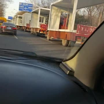 Beijing - A truck fleet transporting 8,000 isolation pods to build a new quarantine camp