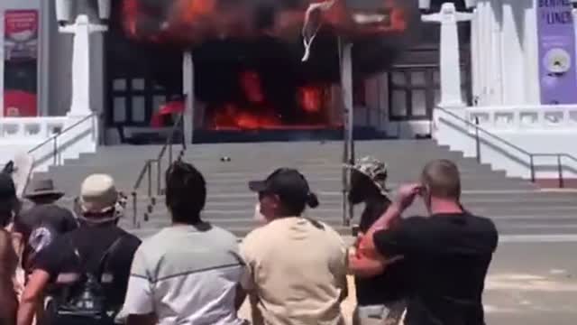 Canberra Australia - Aboriginals set fire to old Parliament & cheer & chant while it burns