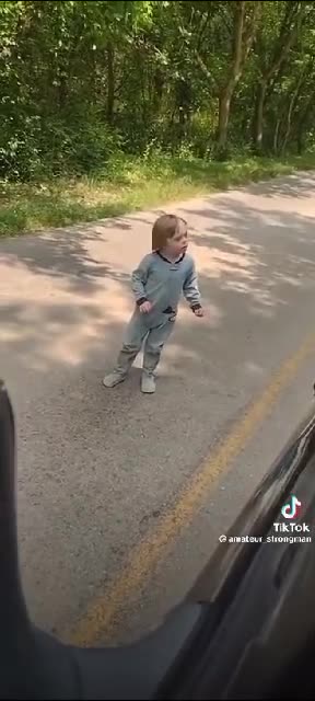 Kid in the middle of the road