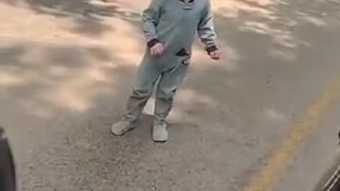 Kid in the middle of the road