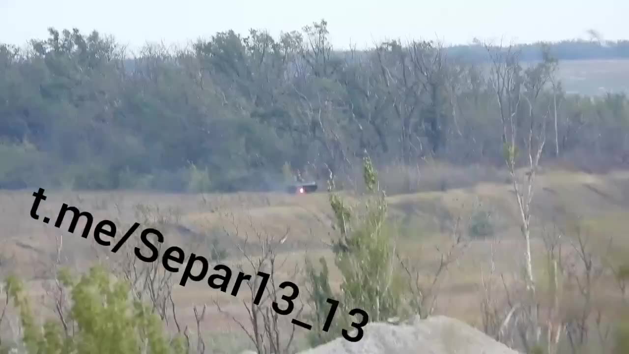 Russian soldiers shot down a Ukrainian BMP from an APC.