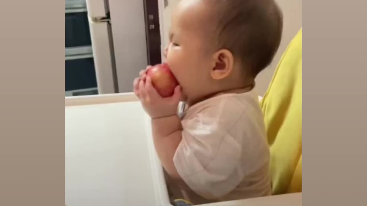 Cute Baby eating an apple