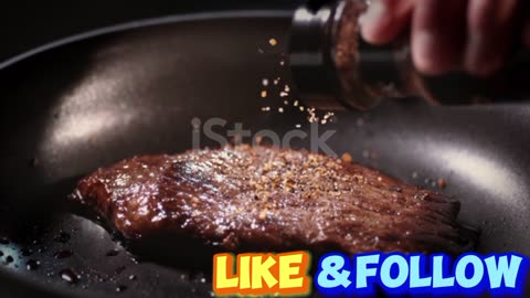 Seasoning is poured onto a cut of meat in a frying pan