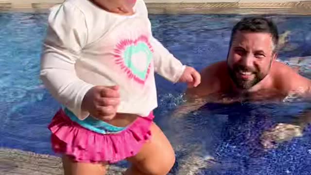 Little kid being fearless on the pool
