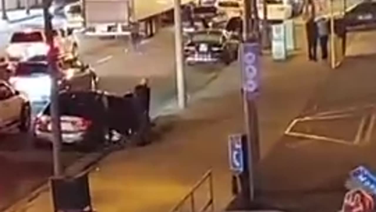 Vehicle fleeing street takeover hits a light pole which falls on a LASD squad car