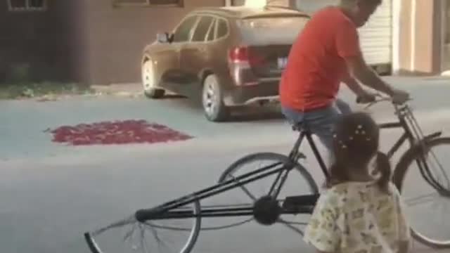 Car repairers rebuild bicycle tires.