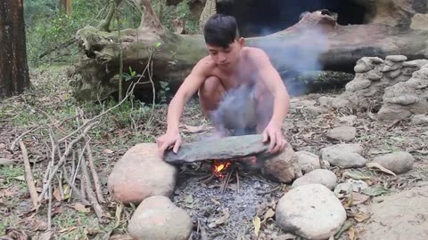 Primitive survival Cook meat on a rock