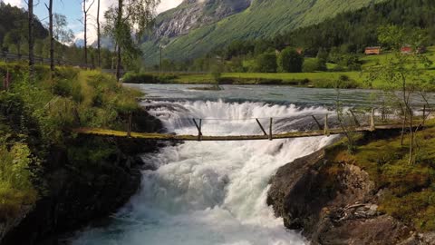 suspension bridge over the mountain river beautiful nature norway natural landscape