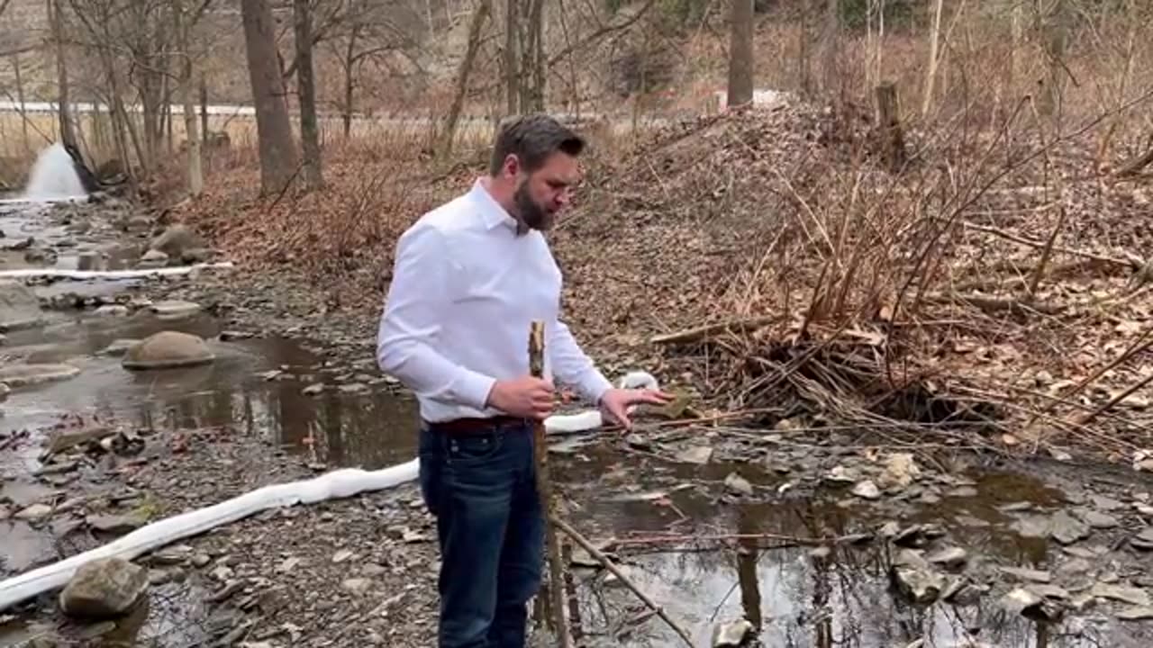 Senator JD Vance visits a creek flowing near the East Palestine train derailment and chemical burn.