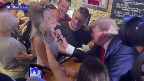 President Trump signed a fan’s top in Iowa.