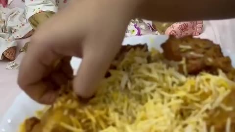 Hindu worshiper serving biryani to her God