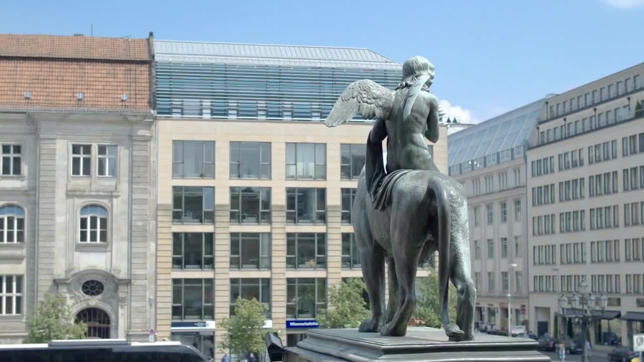 Bronze sculpture of a lion in front of the Konzerthaus in Berlin close-up. Rear view