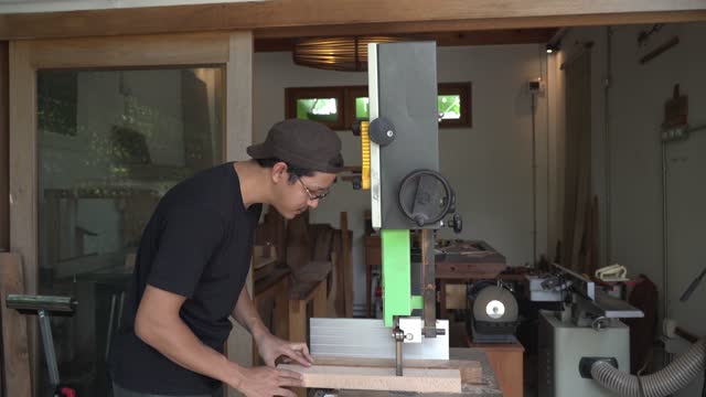 A Man Cutting Wood