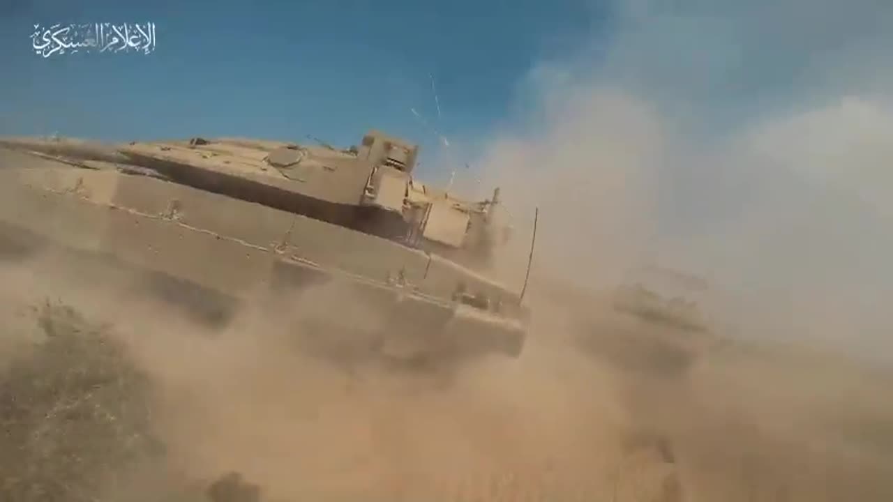 Fighter of Al-Qassam running towards an Israeli tank, placing an IED on it it