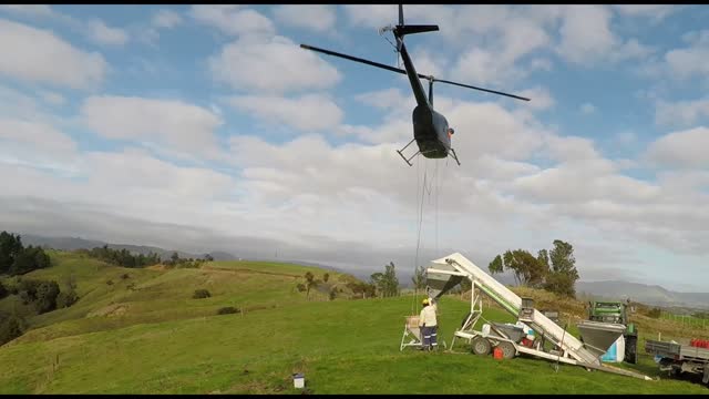 Helicopter fertilizer on farm