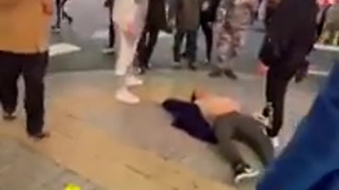 Drunk Tokyo man jumps on car and gets kicked in the face