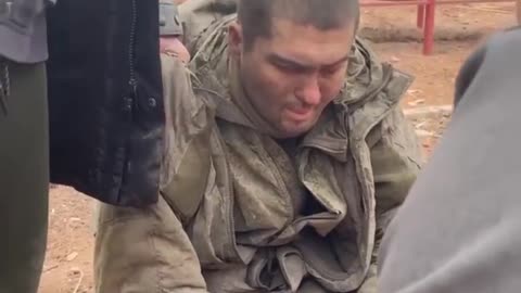 Kharkiv, locals interrogate a captured Russian soldier, a contused campaign.