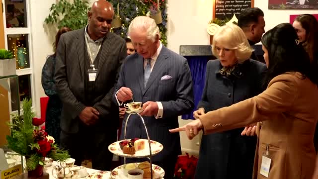 King, Camilla visit London community kitchen