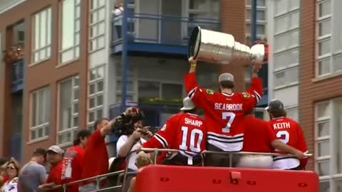 Victorious Blackhawks parade through Chicago