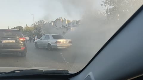 on the road burning old Mercedes
