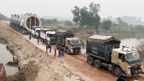 5 trucks together pulled a trailer with 416 tires and crossed Ghaggar river, Amazing truck video
