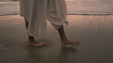 Feet walking on the beach