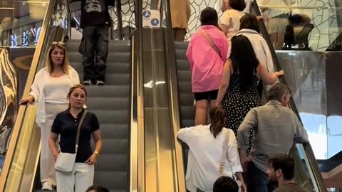 smile of the man in the background