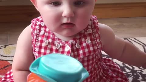 Baby funny reaction when toy is pop up from box