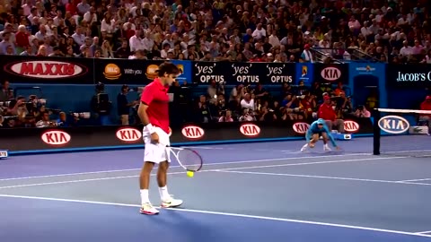 Federrer and ball boys