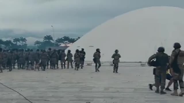 Scenes as security forces move into the grounds of the Brazilian national Congress building.