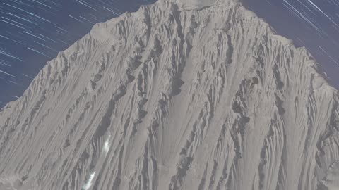 Time-Lapse Shows Mountaineers Climbing Under Starry Sky