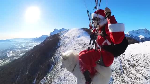 Paragliding Santa Claus Rides on Dog