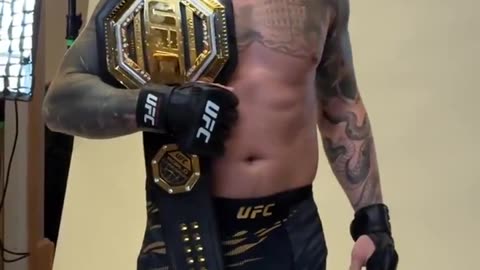 Tom Aspinall poses with his interim heavyweight belt leading up to #UFC309