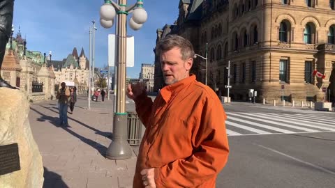 Matthew Hadwen talking to people at the parliament hill