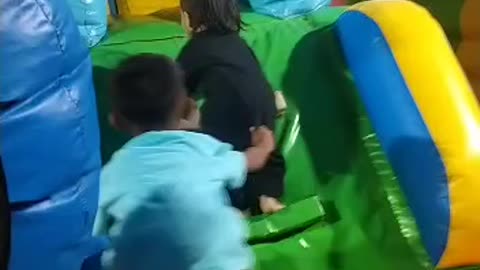 playing in the balloon house