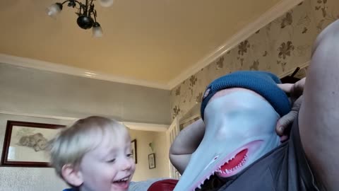 Father Wears Shark Mask On Face And Plays With Son As He Laughs Hilariously