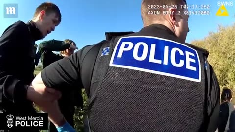 Moment woman trapped inside her car in flooded ford is rescued by police