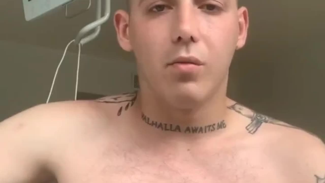 Swastika tattooed on his shoulder, or the Valhalla quotation on his throat