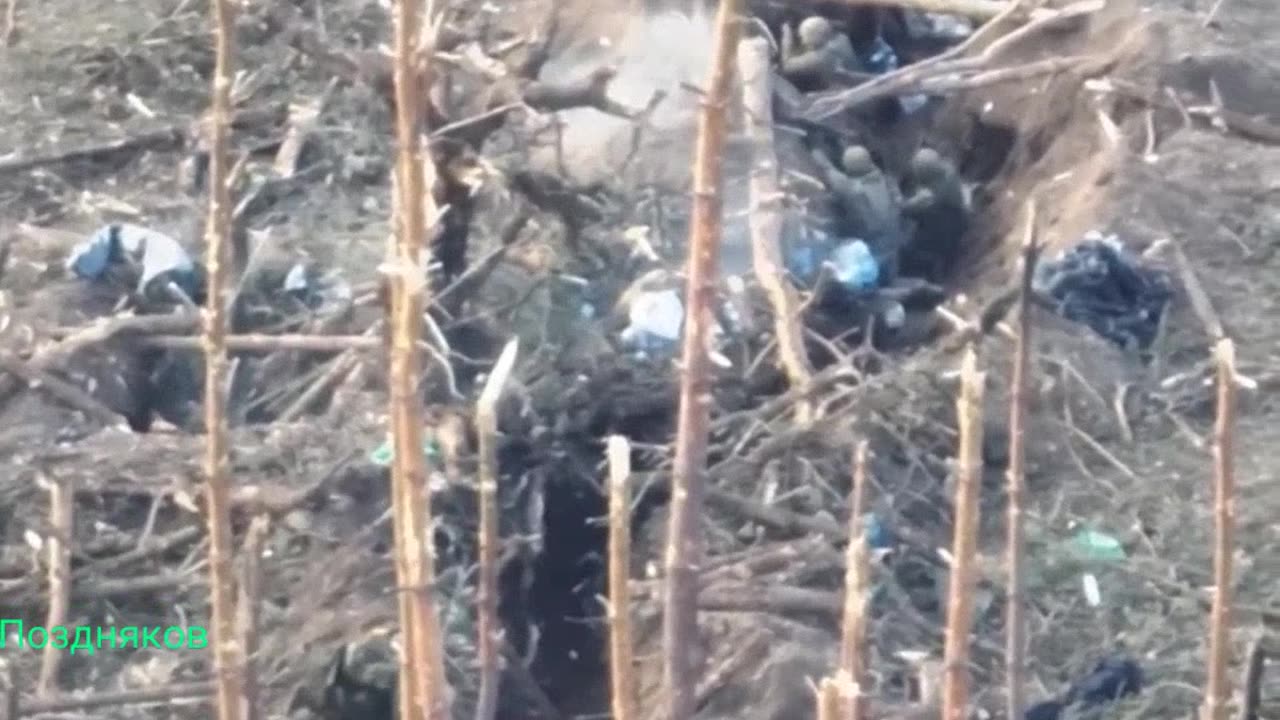 Russian soldier Alexander Maltsev climbs into the Ukrainian trench line.