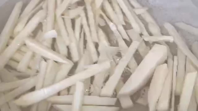 Blanch bamboo shoots in water