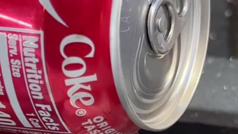 Cutting the top of the coke can