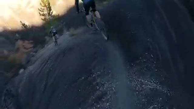 Bicyclists go on Thrilling Ride Along Narrow Mountain Peak